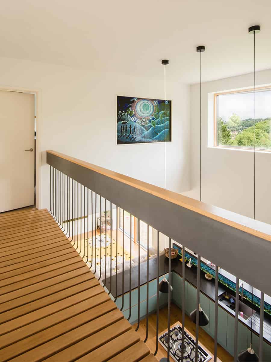 Harleywood House first-floor timber gallery landing overlooking kitchen below